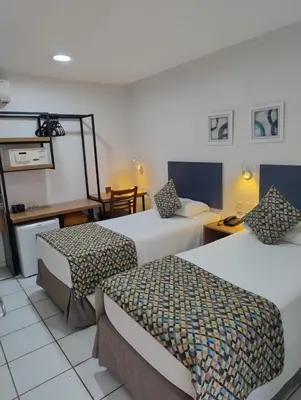 Uma cama ou camas num quarto em Villa Park Hotel Fortaleza