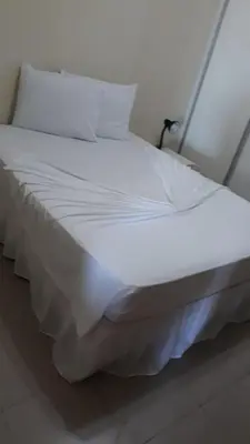 Uma cama ou camas num quarto em Ocean Tower Fortaleza