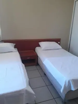 Uma cama ou camas num quarto em Ocean Tower Fortaleza