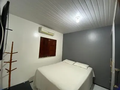 Uma cama ou camas num quarto em Residência Ximenes