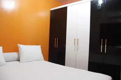 Uma cama ou camas num quarto em Residência Ximenes