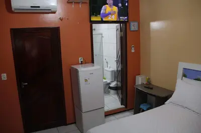 Uma cama ou camas num quarto em Residência Ximenes