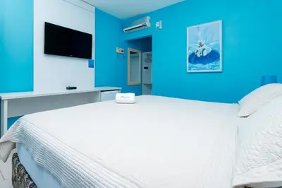 Uma cama ou camas num quarto em Jardim dos Orixás