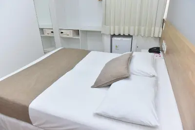 Uma cama ou camas num quarto em Hotel Três Caravelas