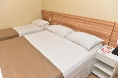 Uma cama ou camas num quarto em Hotel Três Caravelas