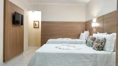 Uma cama ou camas num quarto em Planet Dunas Residence
