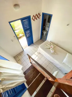 Uma cama ou camas num quarto em Pousada Les Alizes