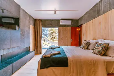Uma cama ou camas num quarto em Hotel Casa do Mar