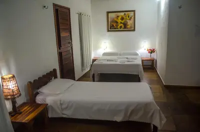 Uma cama ou camas num quarto em Pousada Morada do Sol