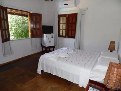 Uma cama ou camas num quarto em Pousada Morada do Sol