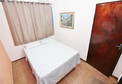 Uma cama ou camas num quarto em Pousada Fortaleza Aeroporto House