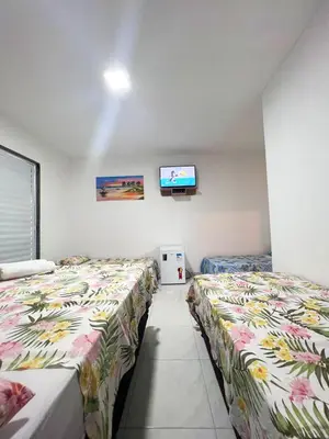 Uma cama ou camas num quarto em Pousada Chalet La Pink