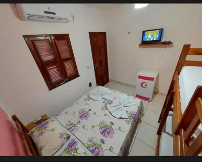Uma cama ou camas num quarto em Pousada Chalet La Pink