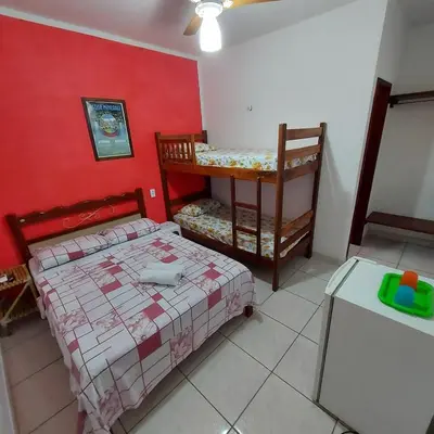 Uma cama ou camas num quarto em Pousada Chalet La Pink