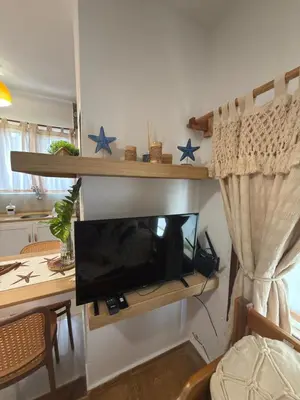 Uma televisão e/ou sistema de entretenimento em Apê Charm Jeri