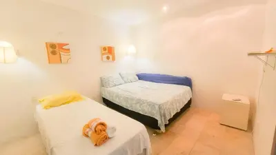 Uma cama ou camas num quarto em Apt no Taiba Beach Resort