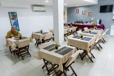 Um restaurante ou outro lugar para comer em Pousada das Maracanãs