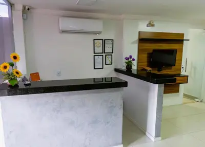 Uma televisão e/ou sistema de entretenimento em Pousada das Maracanãs