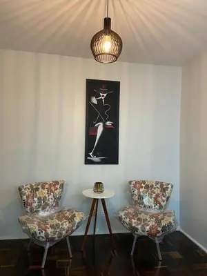 Uma área de estar em Apartamento Mobiliado Temporada