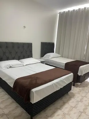 Uma cama ou camas num quarto em Apartamento Mobiliado Temporada
