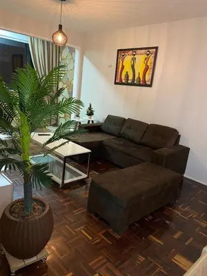 Uma área de estar em Apartamento Mobiliado Temporada