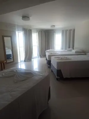 Uma cama ou camas num quarto em Hotel Litoral Fortaleza
