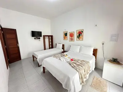 Uma cama ou camas num quarto em Morada da Praia Pousada