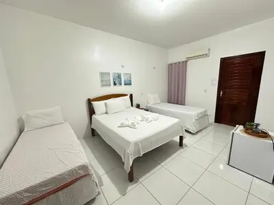 Uma cama ou camas num quarto em Morada da Praia Pousada