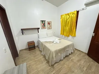 Uma cama ou camas num quarto em Morada da Praia Pousada
