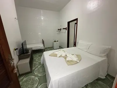 Uma cama ou camas num quarto em Morada da Praia Pousada