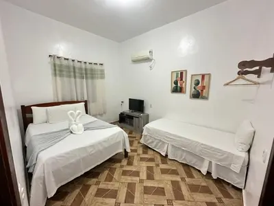 Uma cama ou camas num quarto em Morada da Praia Pousada