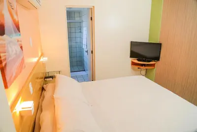 Uma televisão e/ou sistema de entretenimento em Belíssimo Apart com Vista Mar - Conforto a 100m da Orla