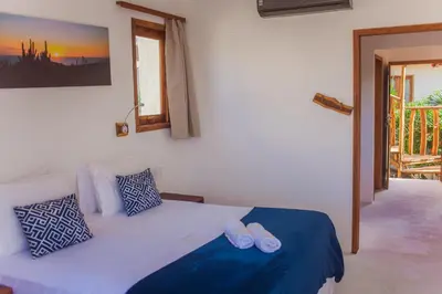 Uma cama ou camas num quarto em Jehol Jericoacoara
