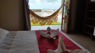 Uma cama ou camas num quarto em Pousada Red House