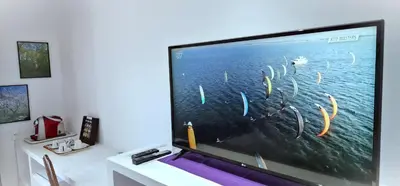 Uma televisão e/ou sistema de entretenimento em Pousada Caminho da Praia