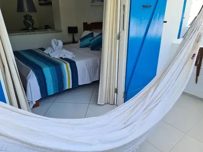 Uma cama ou camas num quarto em Pousada Caminho da Praia