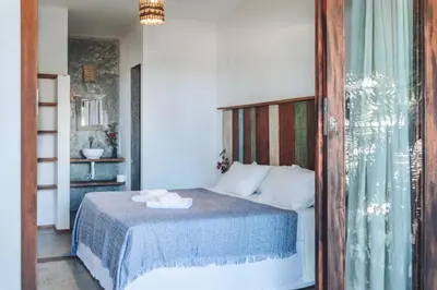 Uma cama ou camas num quarto em Casa Nomade
