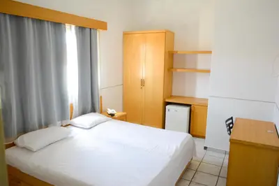 Uma cama ou camas num quarto em Hotel Villa Real