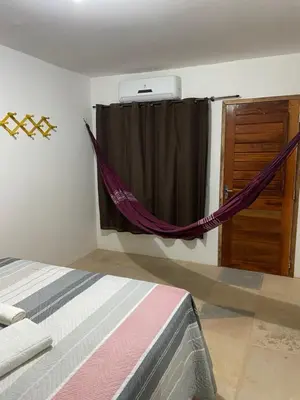 Uma cama ou camas num quarto em Jangadas do Pontal