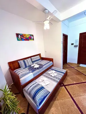 Uma cama ou camas num quarto em Residencial Bem-te-vi