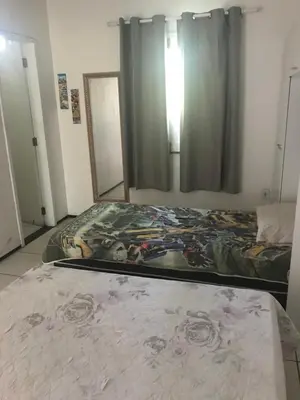 Uma cama ou camas num quarto em Toca do guaxinim