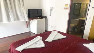 Uma cama ou camas num quarto em Pousada do Sol