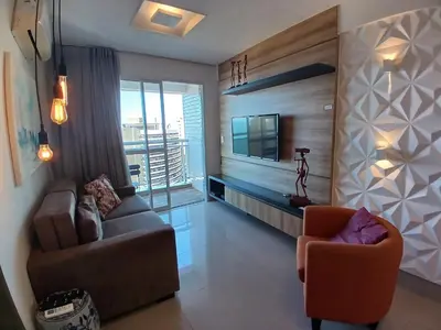 Uma televisão e/ou sistema de entretenimento em My Way Abolição Vista Mar by Escala Imóveis