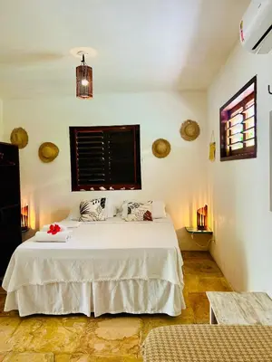 Uma cama ou camas num quarto em Pousada Tangerina