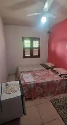 Uma cama ou camas num quarto em Suites Solar dos Arcanjos Guaramiranga