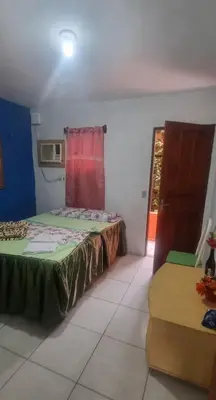 Uma cama ou camas num quarto em Suites Solar dos Arcanjos Guaramiranga