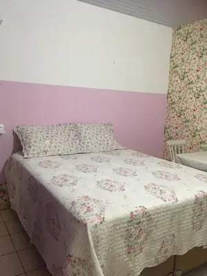 Uma cama ou camas num quarto em Pousada Casa da Adriana