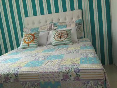 Uma cama ou camas num quarto em Pousada Casa da Adriana
