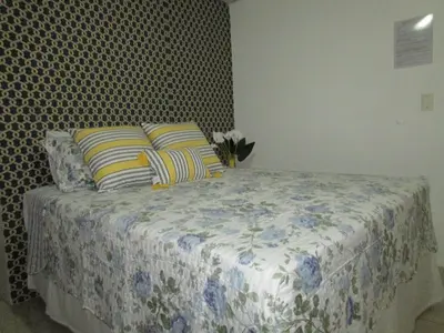 Uma cama ou camas num quarto em Pousada Casa da Adriana
