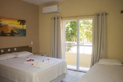 Uma cama ou camas num quarto em Pedacinho do Paraiso Pousada